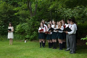 The Sacred Heart Audeamus Choir beginning the service
